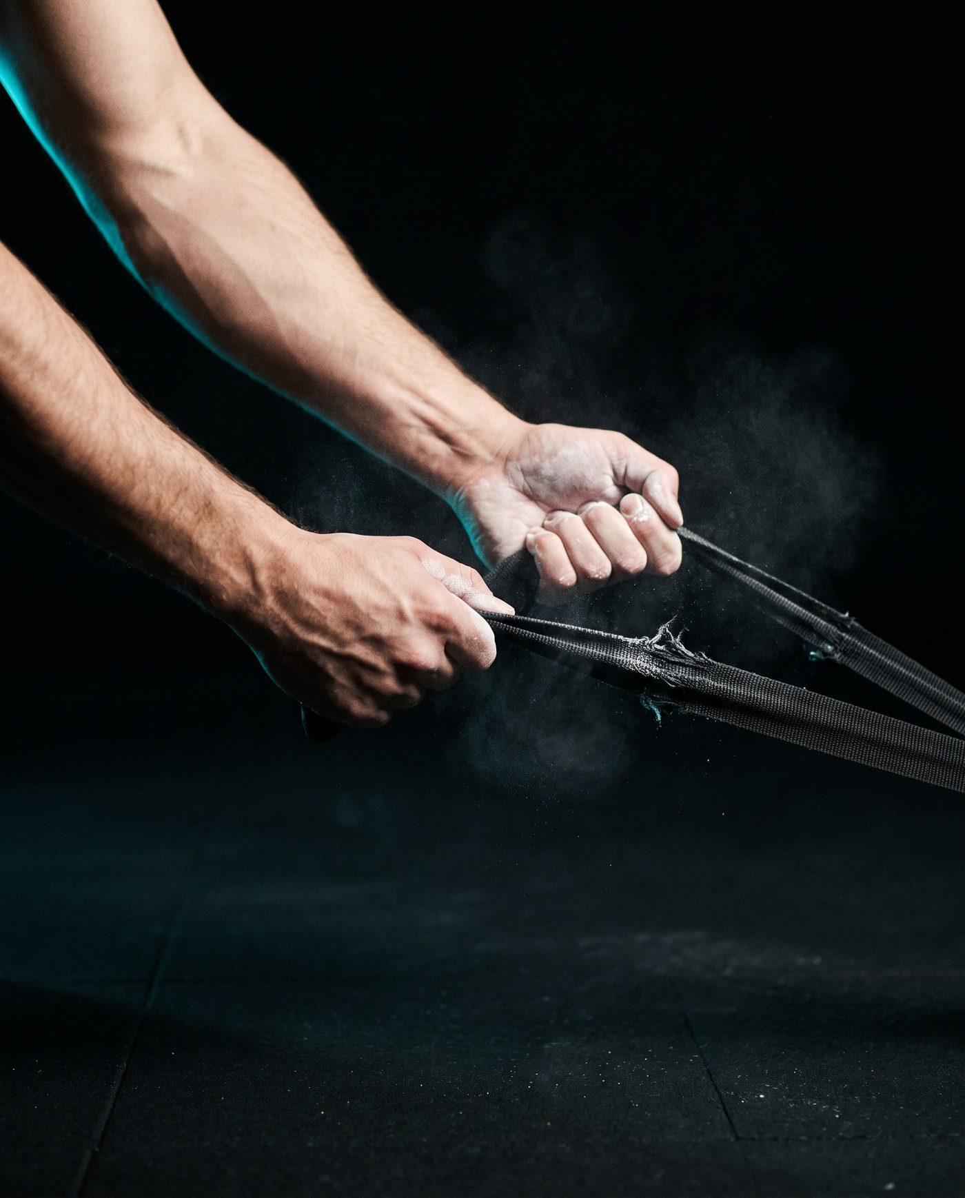 Forearms pulling a resistance band to full tension